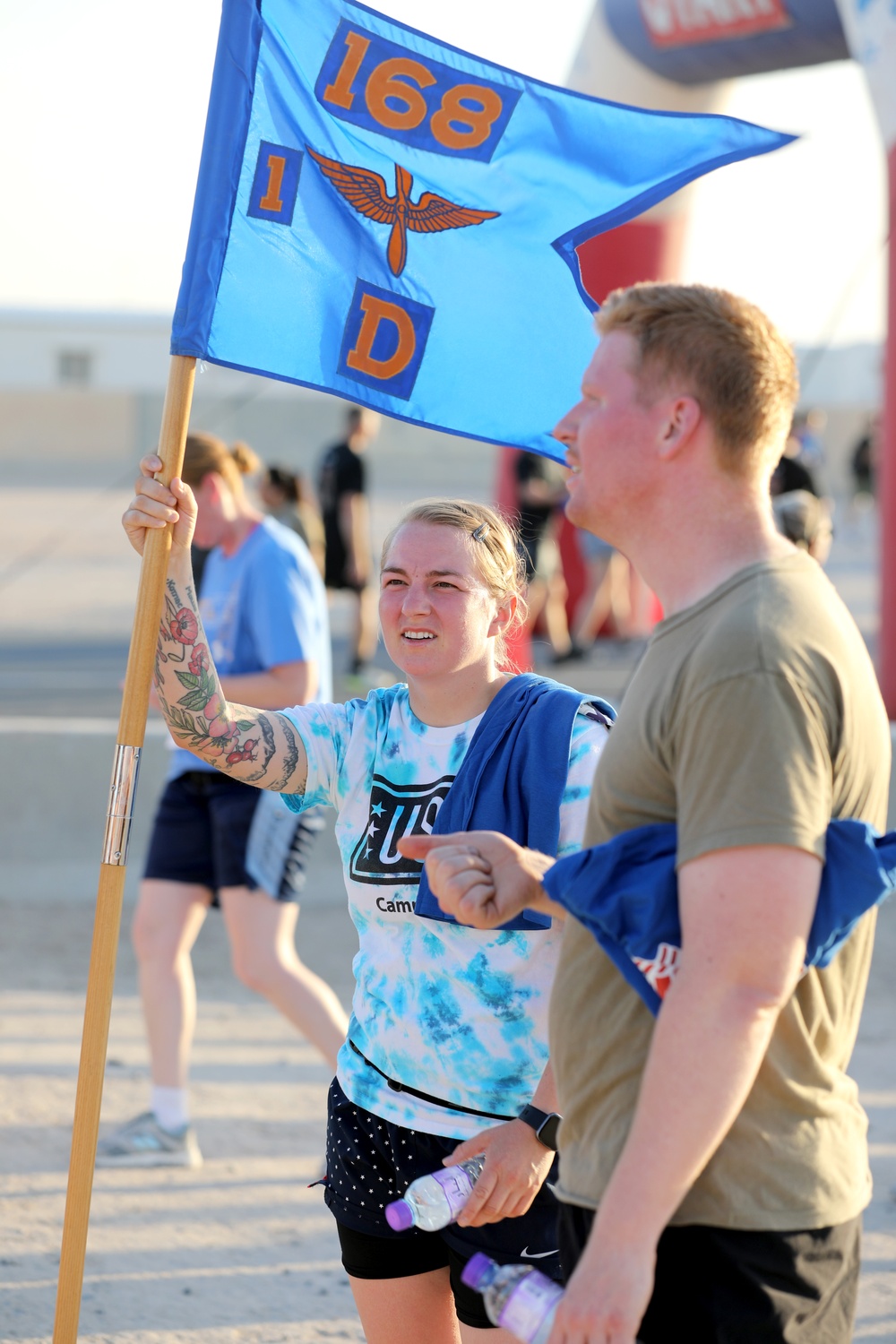 Soldiers participate in a 4th of July Super Hero 5K Fun Run/Walk at Camp Buehring, Kuwait