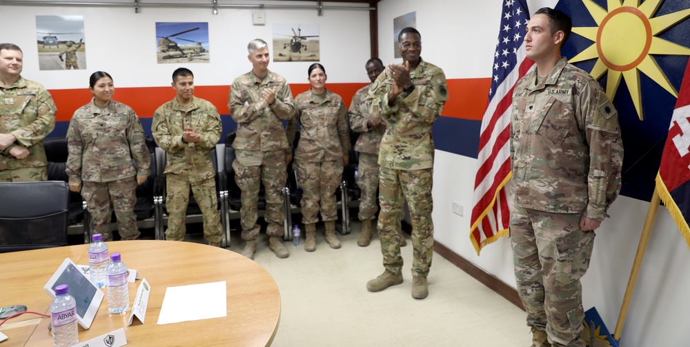 Brig. Gen. Brandon Parker coins Soldiers of Task Force Phoenix at Camp Beuhring, Kuwait