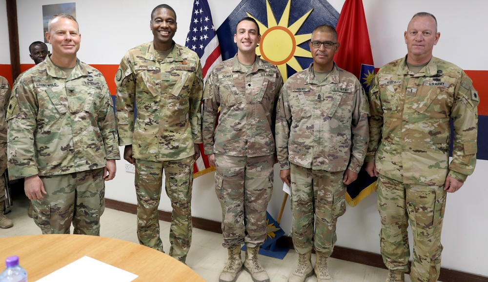 Brig. Gen. Brandon Parker coins Soldiers of Task Force Phoenix at Camp Beuhring, Kuwait