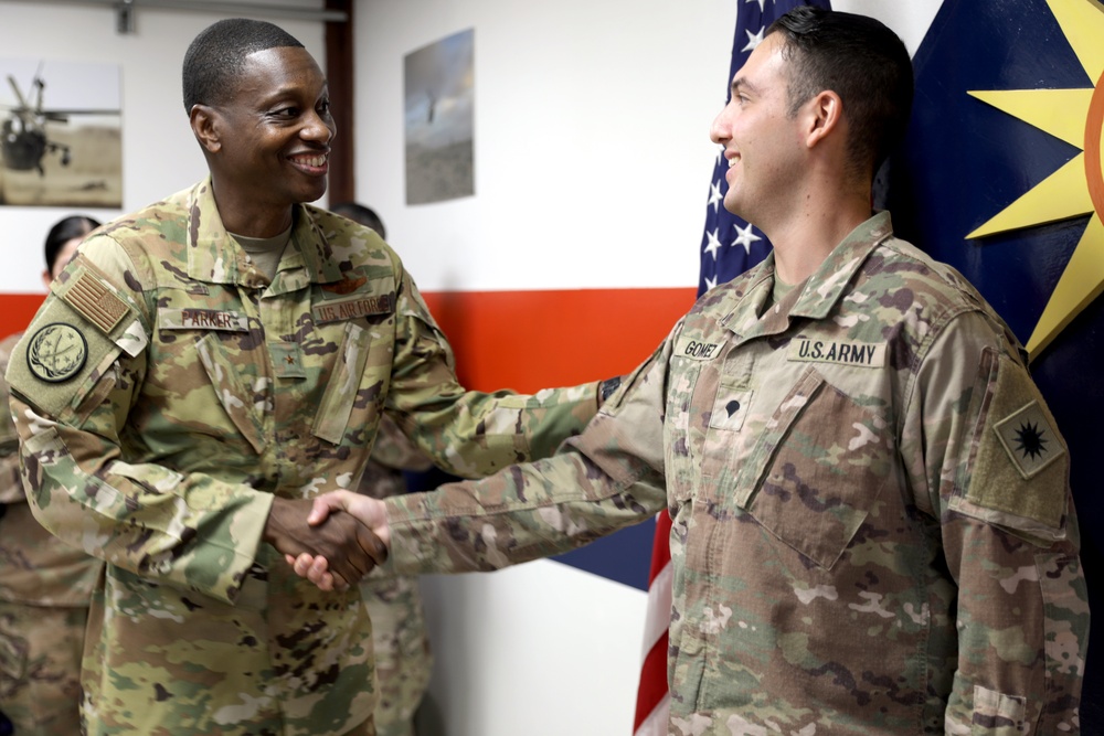 Brig. Gen. Brandon Parker coins Soldiers of Task Force Phoenix at Camp Beuhring, Kuwait