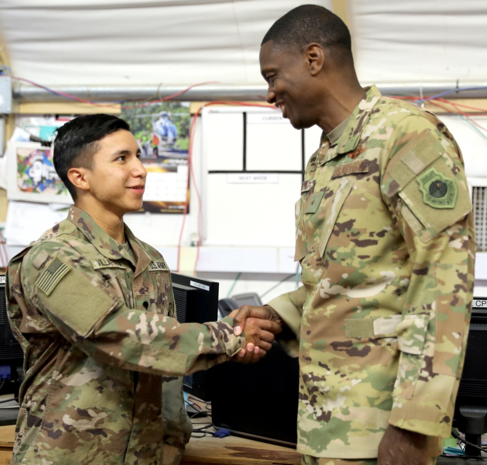 Brig. Gen. Brandon Parker coins Soldiers of Task Force Phoenix at Camp Beuhring, Kuwait