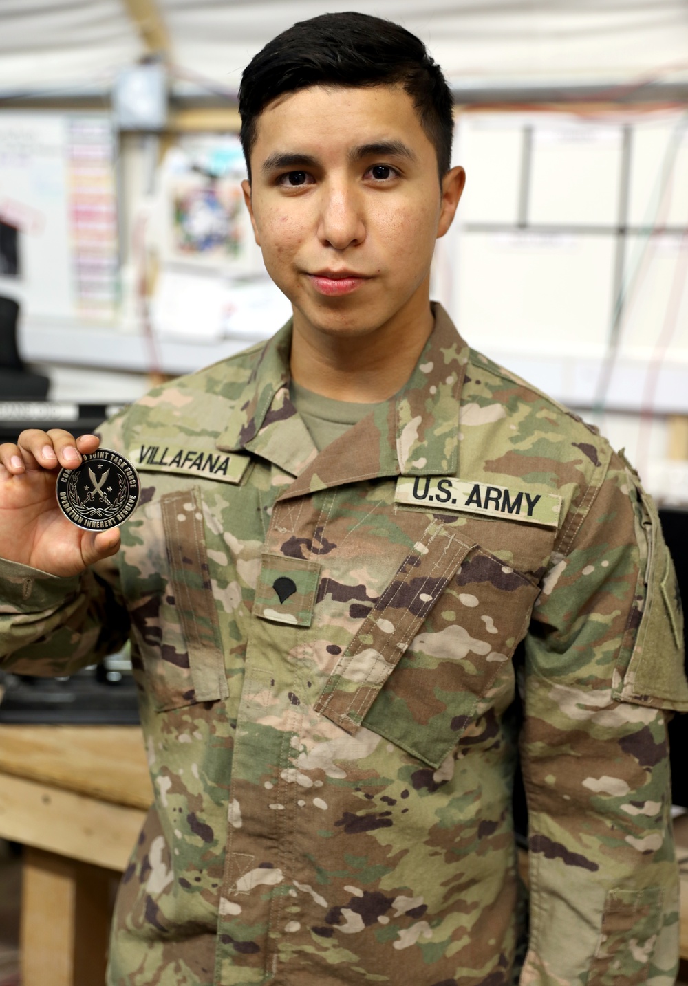 Brig. Gen. Brandon Parker coins Soldiers of Task Force Phoenix at Camp Beuhring, Kuwait