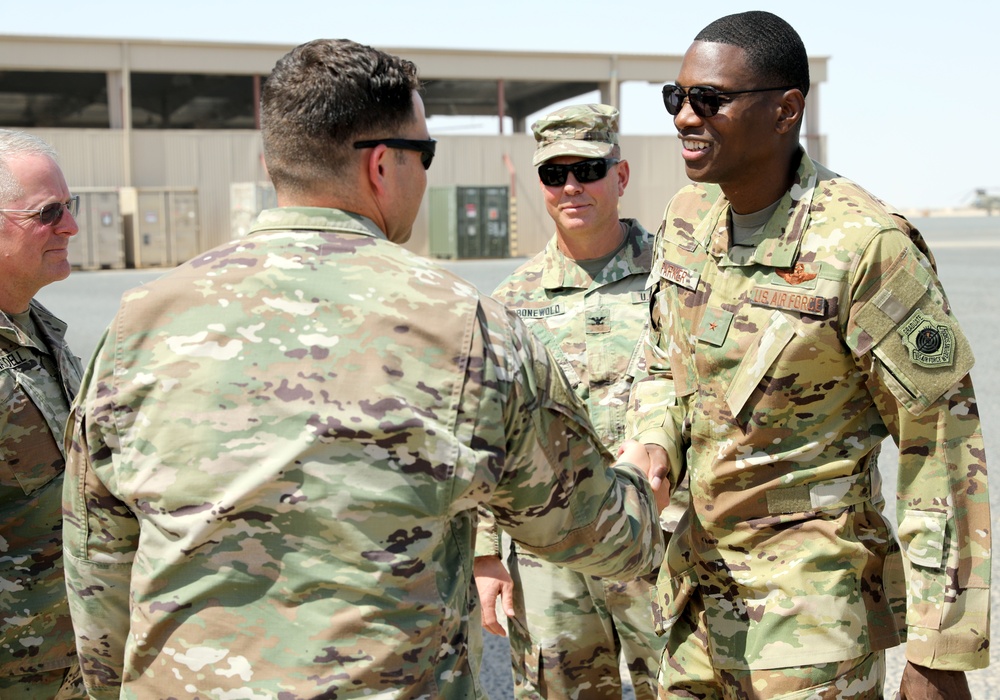 Brig. Gen. Brandon Parker coins Soldiers of Task Force Phoenix at Camp Beuhring, Kuwait