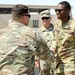 Brig. Gen. Brandon Parker coins Soldiers of Task Force Phoenix at Camp Beuhring, Kuwait