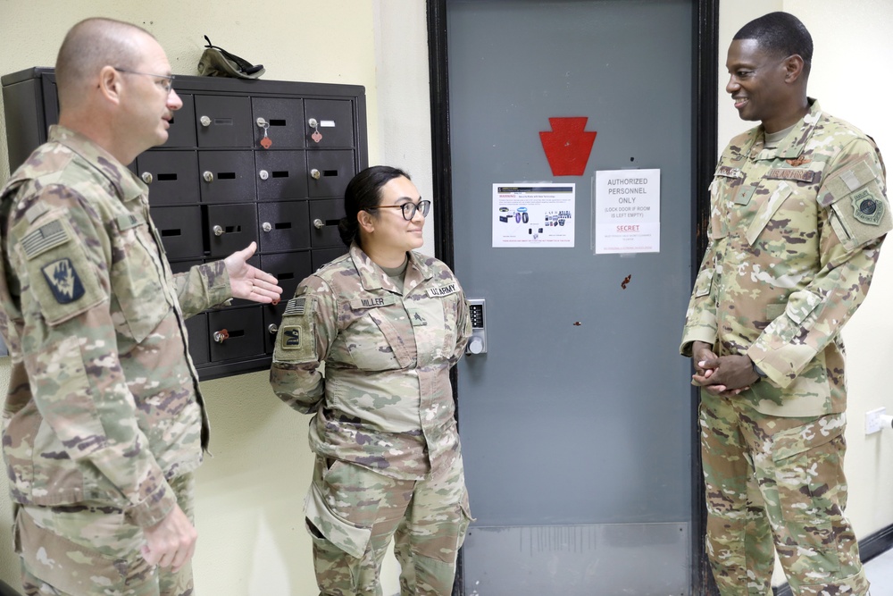 Brig. Gen. Brandon Parker coins Soldiers of Task Force Phoenix at Camp Beuhring, Kuwait