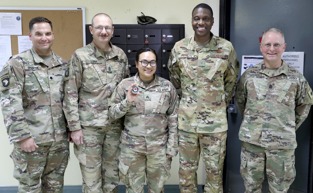 Brig. Gen. Brandon Parker coins Soldiers of Task Force Phoenix at Camp Beuhring, Kuwait