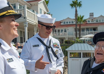 Sailors talk with WW2 Veteran
