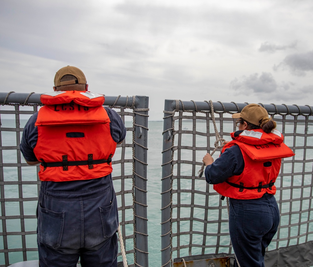 USS Billings Sailors Prepare to Lower the Flight Deck Nets During Sea and Anchor Detail