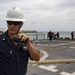 USS Billings Sailor Calls Out from His Station During Sea and Anchor Detail