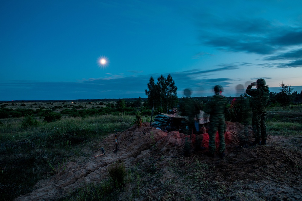 U.S. Army and Croatian soldiers work together to coordinate mortar fire