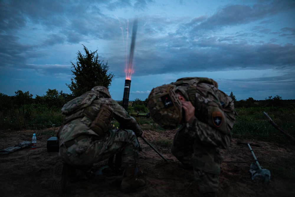 U.S. Army and Croatian soldiers work together to coordinate mortar fire