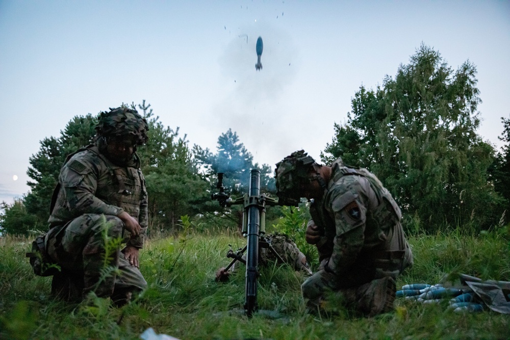 U.S. Army and Croatian soldiers work together to coordinate mortar fire