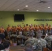Warrant Officer Candidate School Class 21-301 holds sign, song and hat ceremony