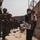 Marines with the 24th Expeditionary Unit (MEU) guide an evacuee during an evacuation at Hamid Karzai International Airport
