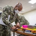 Sailors build kits for a back to school supplies drive