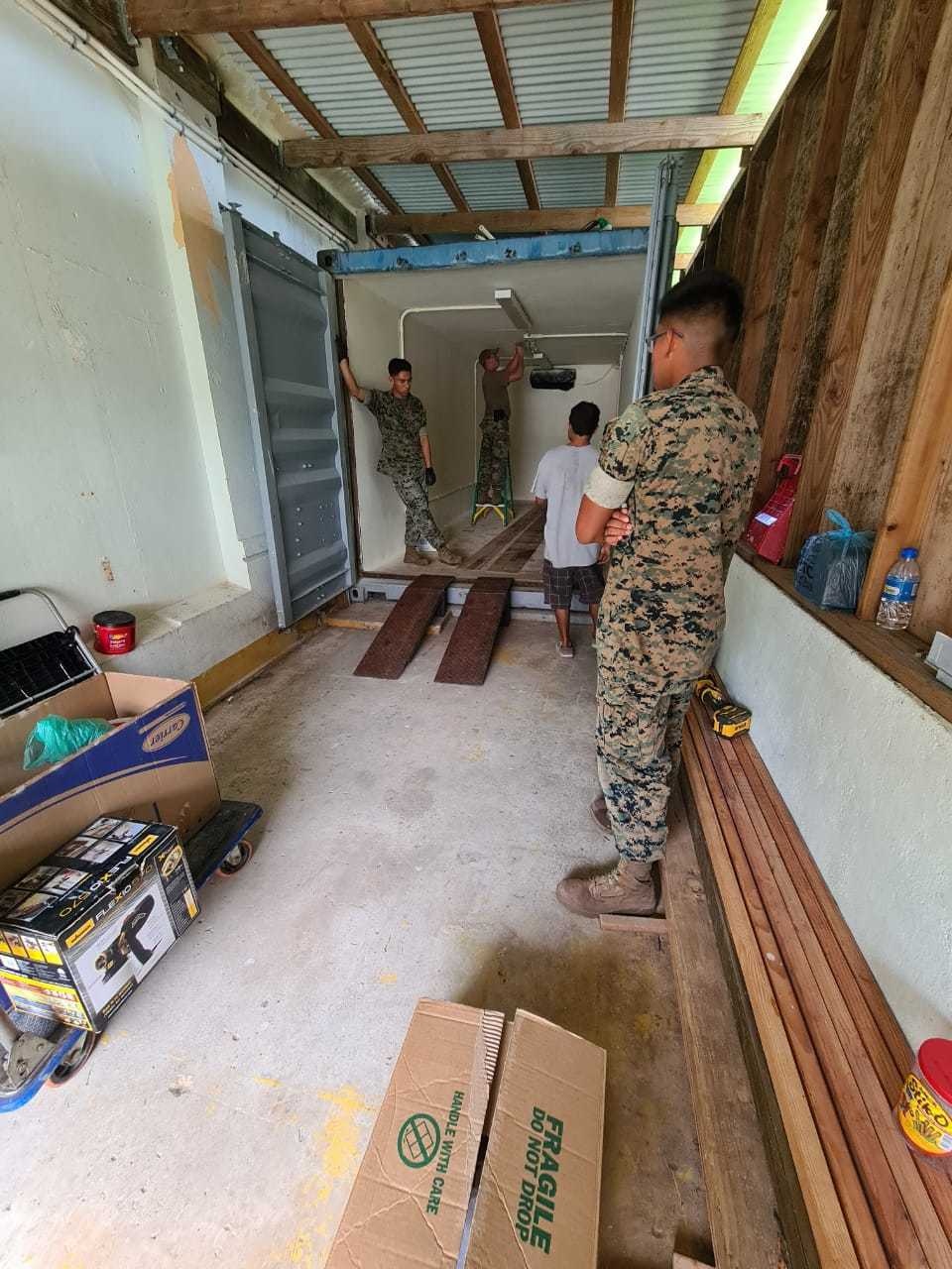 7th Engineer Support Battalion Marines build a ramp to help the local museum transport historical artifacts for cleaning, repair, and display.