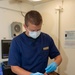 Sailors Performs Dental Exam