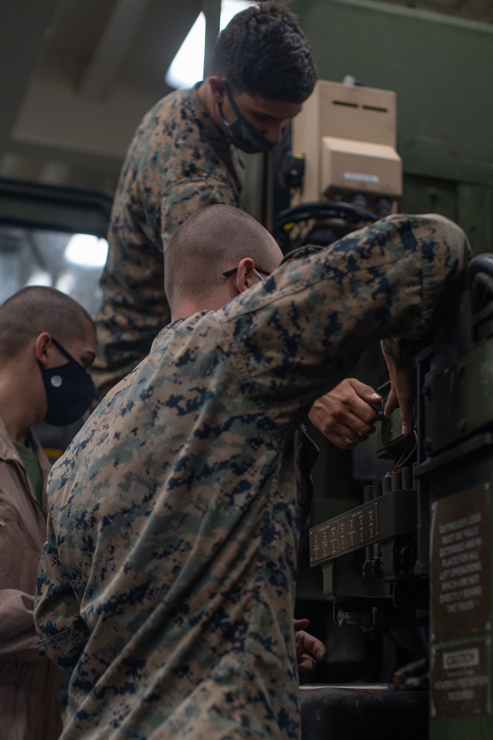 11th MEU Motor Transportation Marines Conduct Maintenance on Vehicles