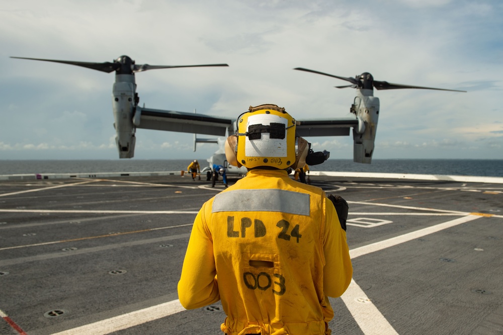 USS Arlington Sailor Stands Landing Signalman Enlisted During Flight Ops