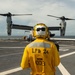 USS Arlington Sailor Stands Landing Signalman Enlisted During Flight Ops