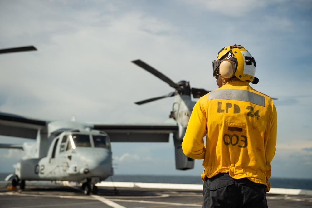 USS Arlington Sailor Stands Landing Signalman Enlisted During Flight Ops