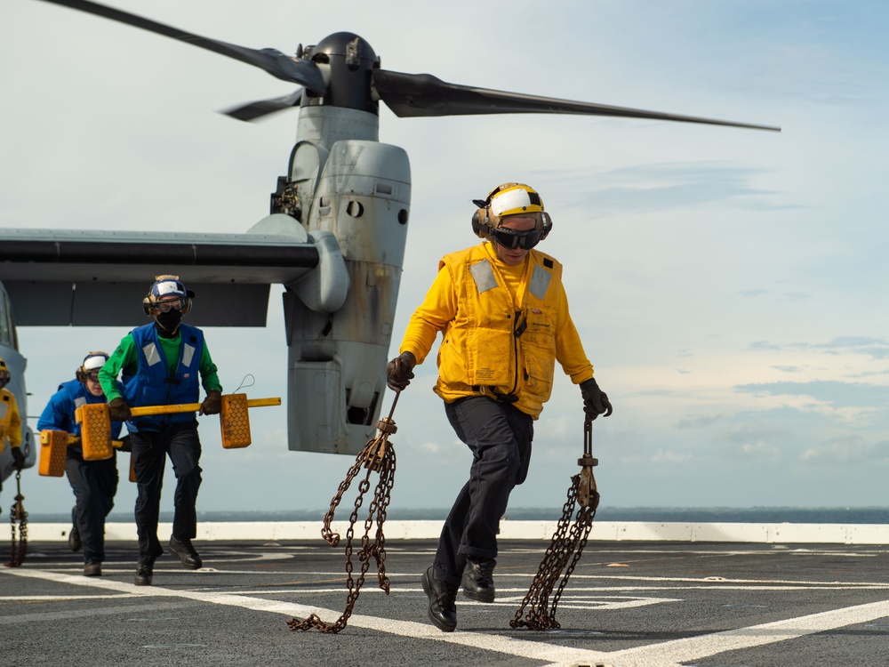 USS Arlington Sailors Remove Chocks and Chains From an MV-22 Osprey