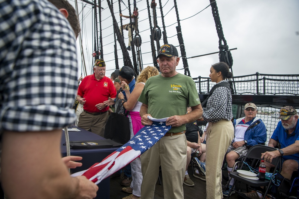 Sailor folds flag with Vietnam veteran aboard USS Constitution