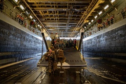 Marines Disembark a Landing Craft Aboard USS Arlington