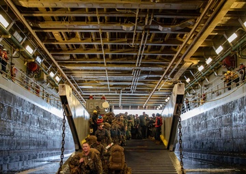 Marines and Sailors arrive aboard the USS Arlington in support of Haiti disaster relief