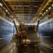 Marines Disembark a Landing Craft Aboard USS Arlington