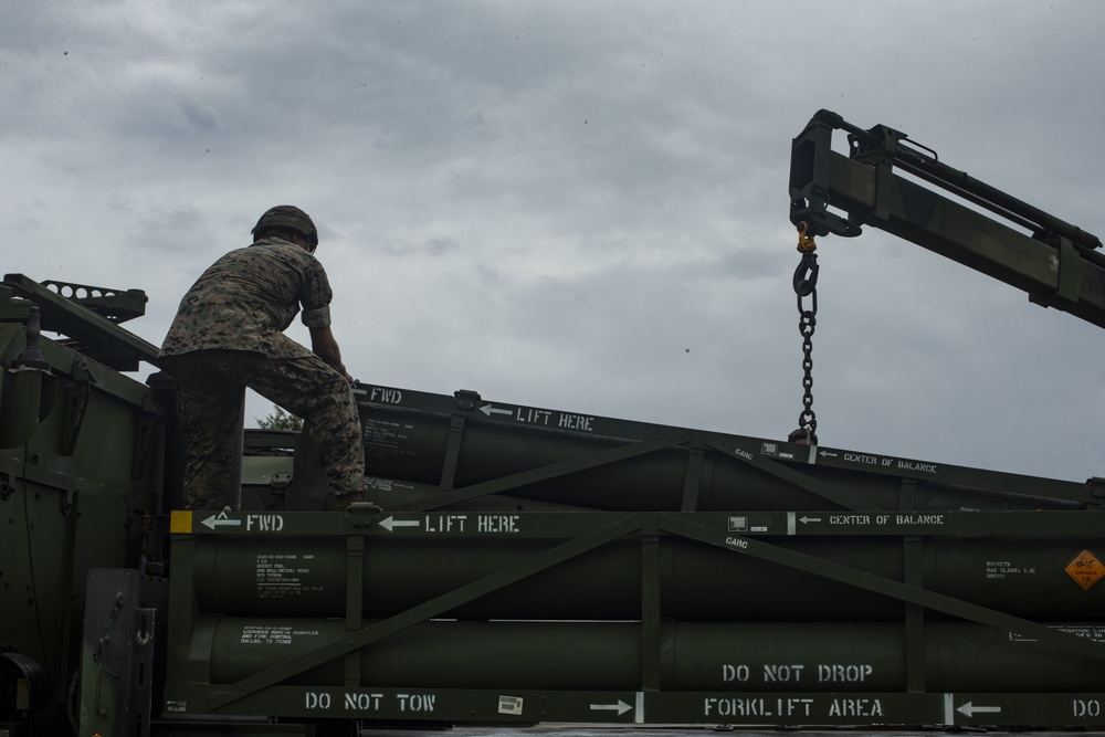 U.S. Marines transport HIMARS from USS New Orleans to Kin Blue