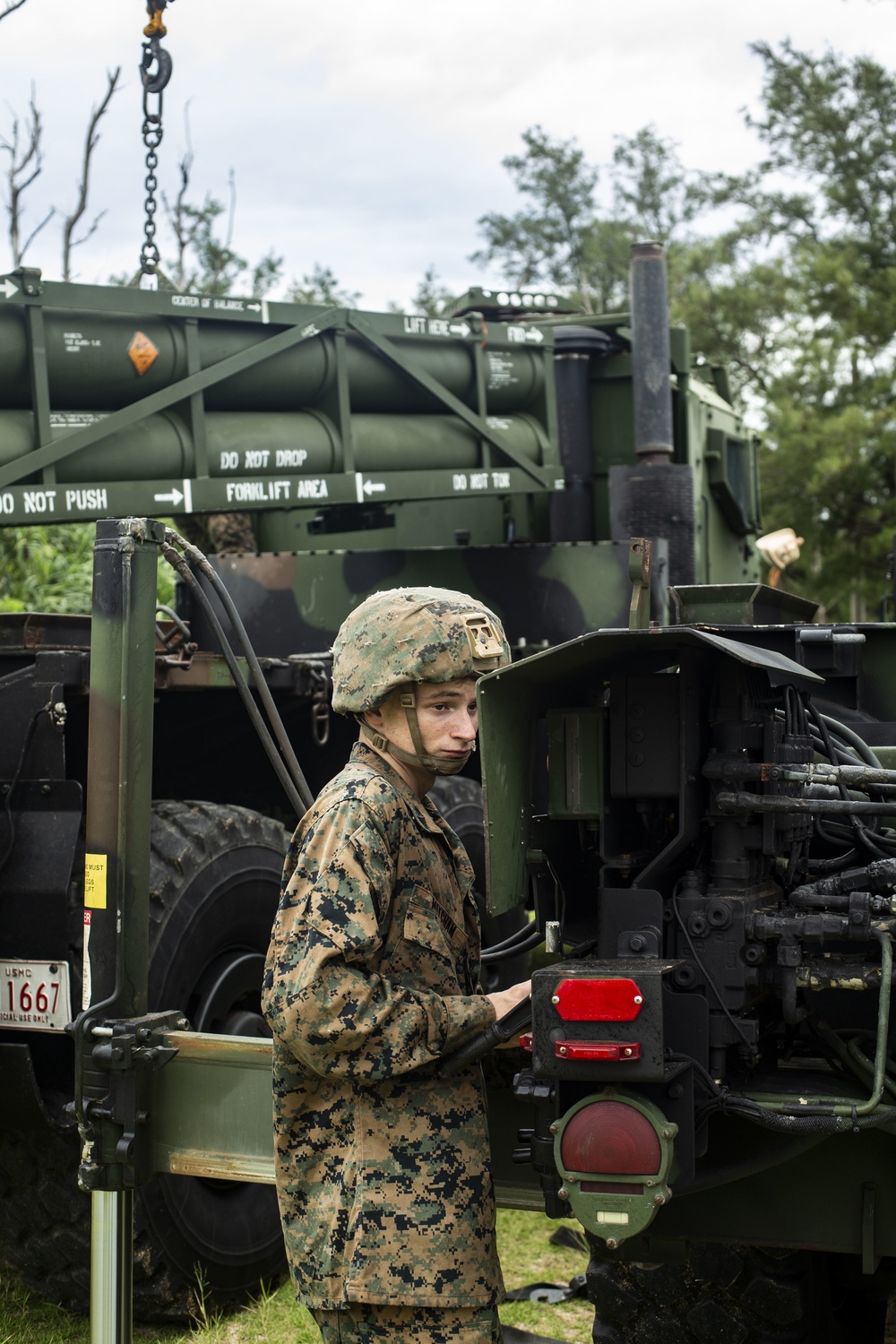 U.S. Marines transport HIMARS from USS New Orleans to Kin Blue