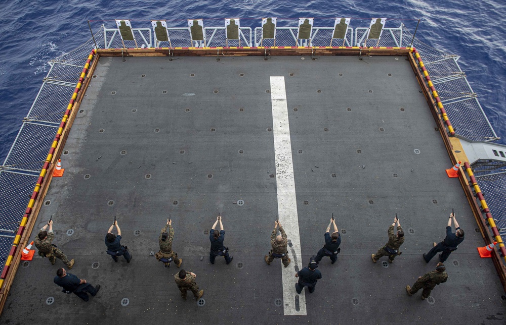 Sailors and Marines have a marksman competition on the USS America LHA 6.