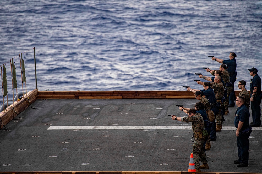 Sailors and Marines have a marksman competition on the USS America LHA 6.