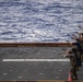 Sailors and Marines have a marksman competition on the USS America LHA 6.