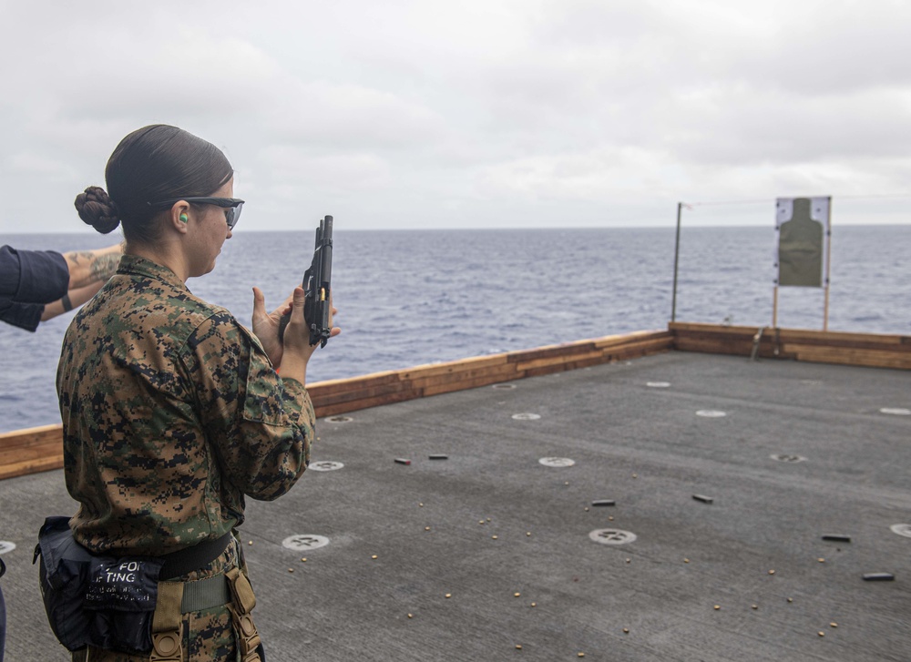 Sailors and Marines have a marksman competition on the USS America LHA 6.
