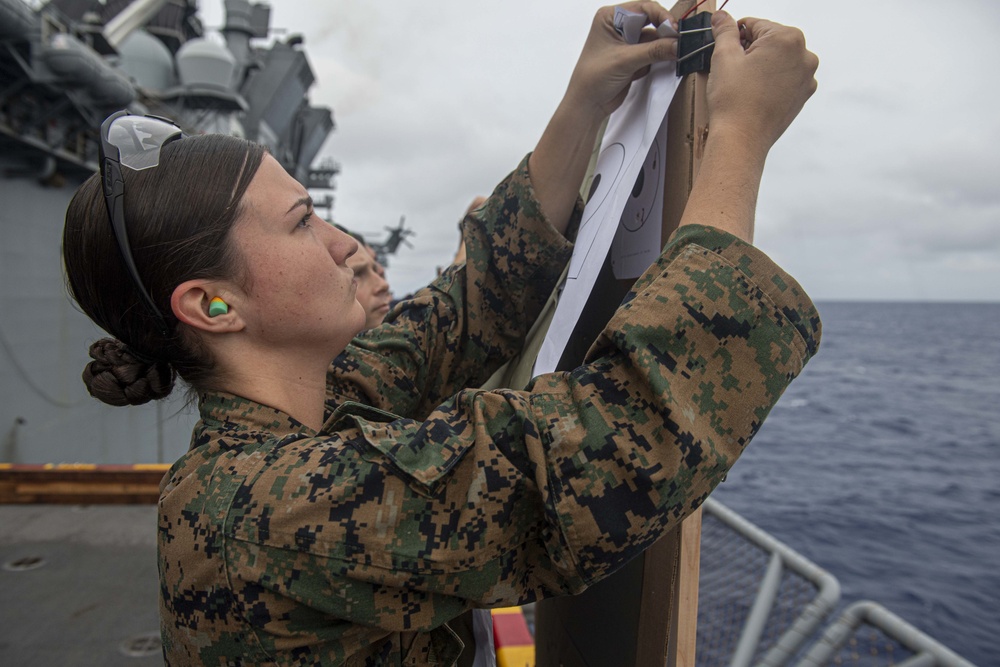 Sailors and Marines have a marksman competition on the USS America LHA 6.