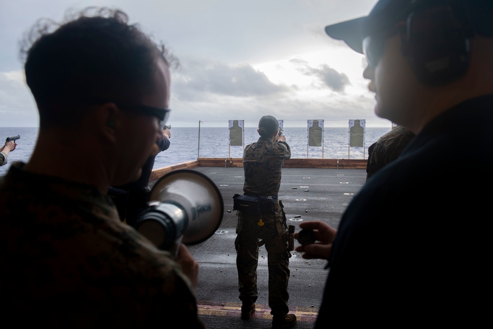 Sailors and Marines have a marksman competition on the USS America LHA 6.