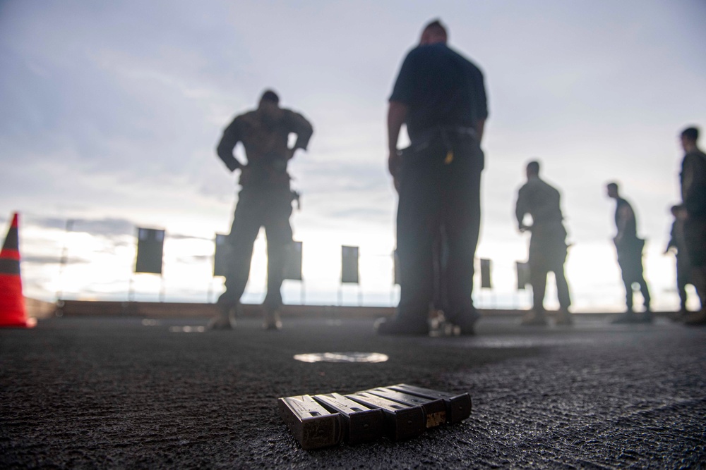 Sailors and Marines have a marksman competition on the USS America LHA 6.