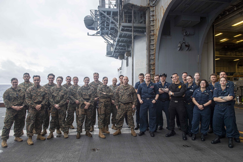 Sailors and Marines have a marksman competition on the USS America LHA 6.