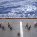 Marines assigned to the 31st Marine Expeditionary Unit participate in a fast rope and live fire exercise.