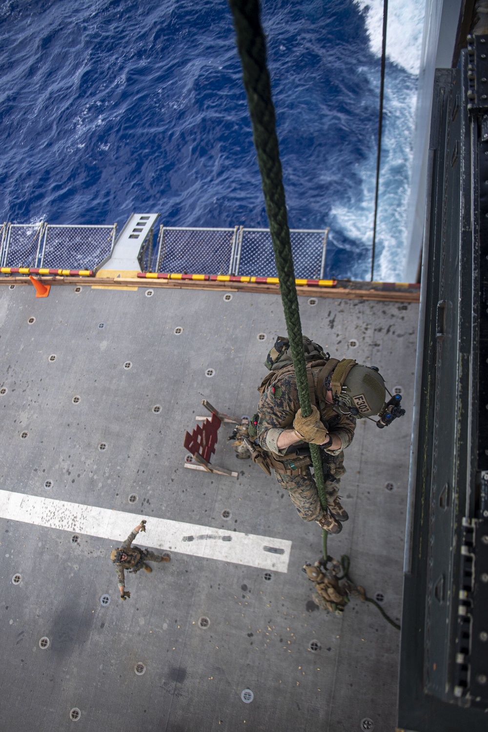 Marines assigned to the 31st Marine Expeditionary Unit participate in a fast rope and live fire exercise.