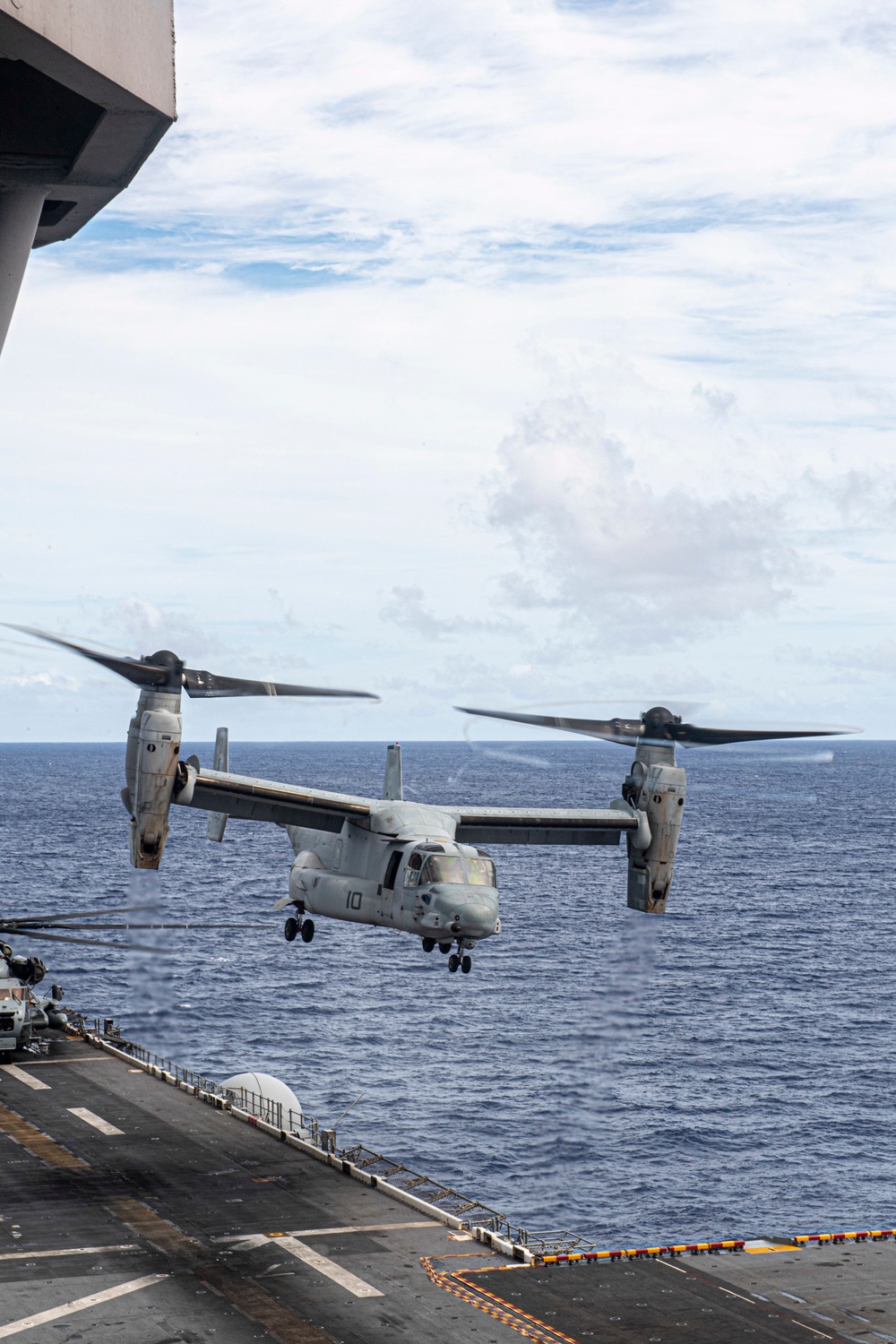 Marines assigned to the 31st Marine Expeditionary Unit take off of the forward-deployed amphibious assault ship USS America (LHA 6) for a long-range raid.