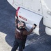 Sailor cleans aircraft aboard USS Carl Vinson (CVN 70)