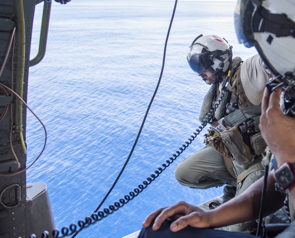 MH-60S Sea hawk flies over USS Jackson (LCS 6)