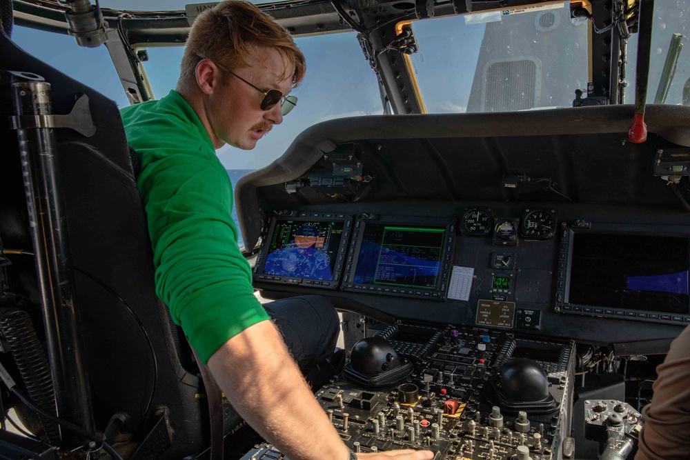 HSC 26 Sailor Conducts Avionics Training on MH-60S Seahawk Helicopter