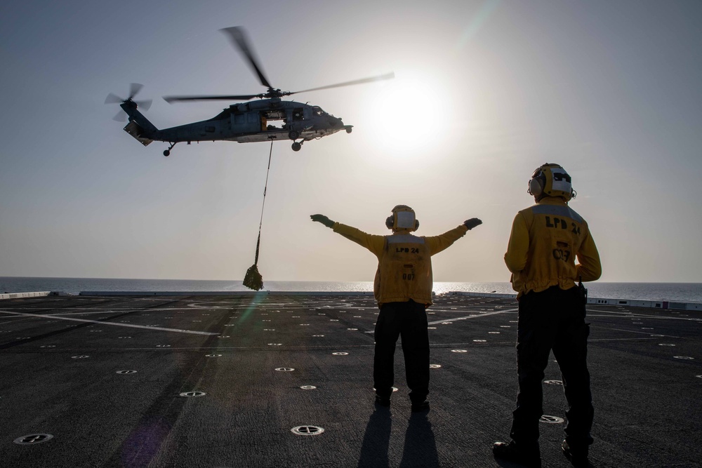 USS Arlington Sailor Directs a Helicopter During Vertical Replenishment Training