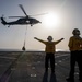 USS Arlington Sailor Directs a Helicopter During Vertical Replenishment Training