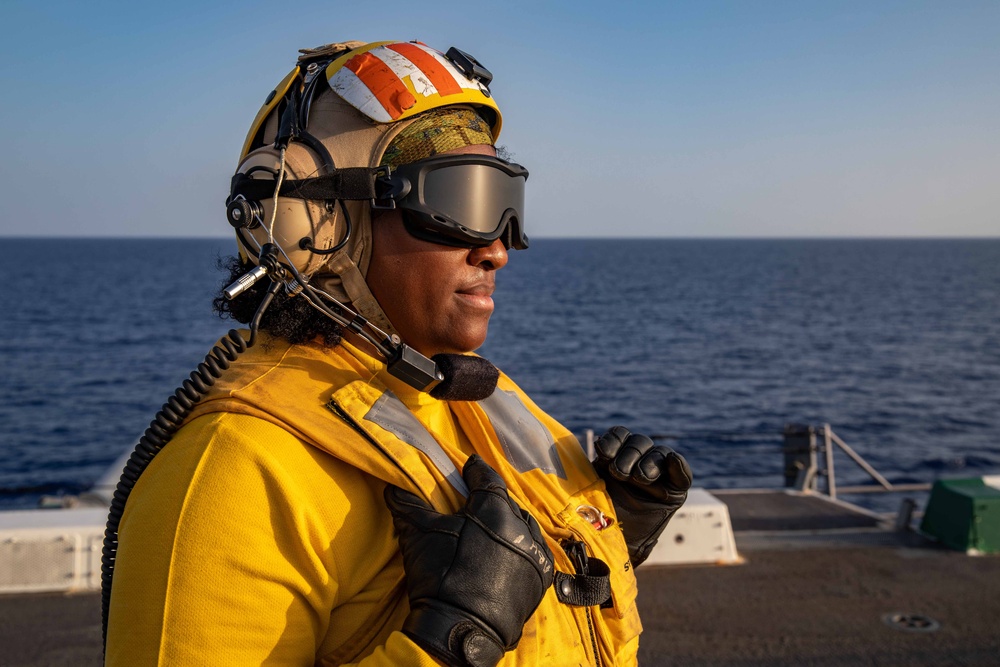 USS Arlington Sailor Observes Flight Operations