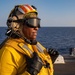 USS Arlington Sailor Observes Flight Operations